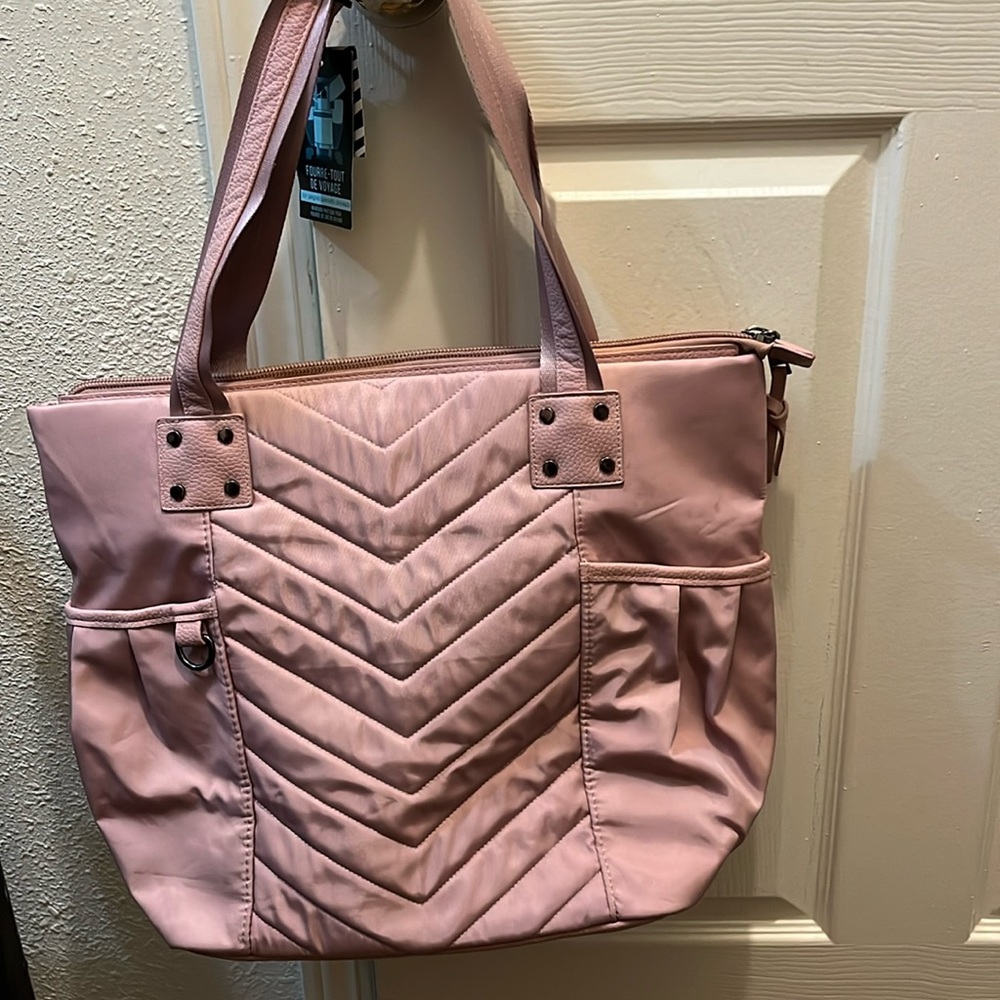 This is a Cynthia Rowley travel tote. I don’t know the exact size.